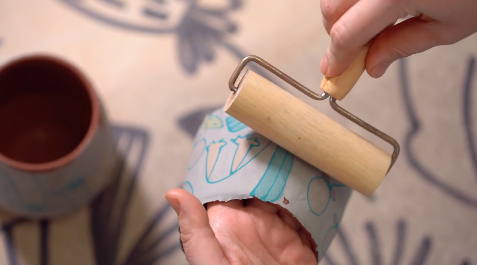 Load video: Catie Miller doing handmade pottery and slip transfer process